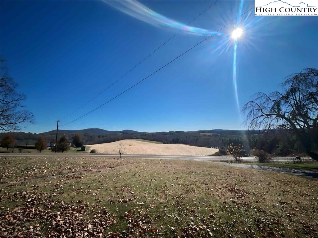 1145 Lazy Branch Road Ennice, NC 28623 - Photo 2 of 13 a view of a yard