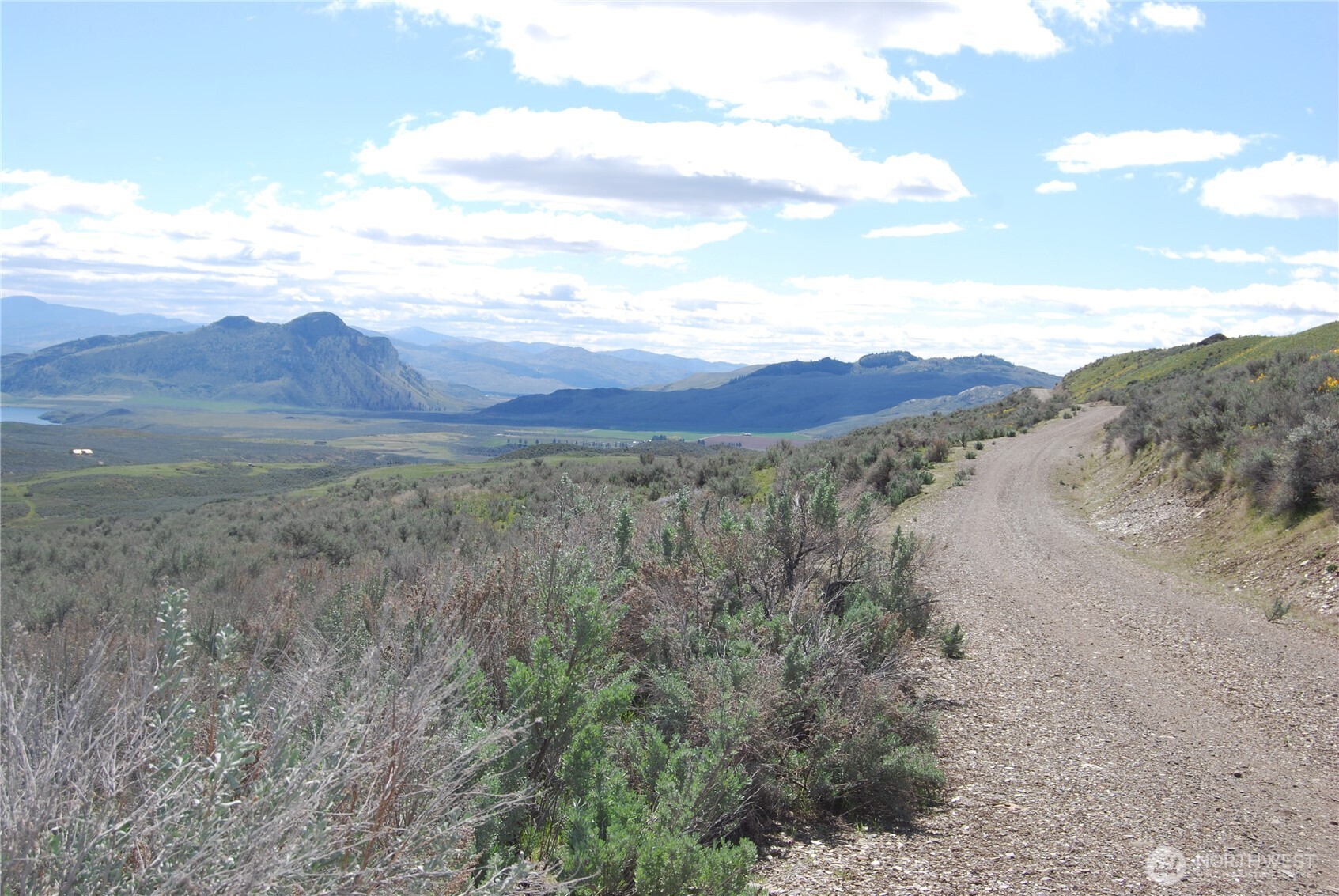 0 Lower White Road Oroville, WA 98844 - Photo 7 of 15 a view of a mountain range with a lush green hillside