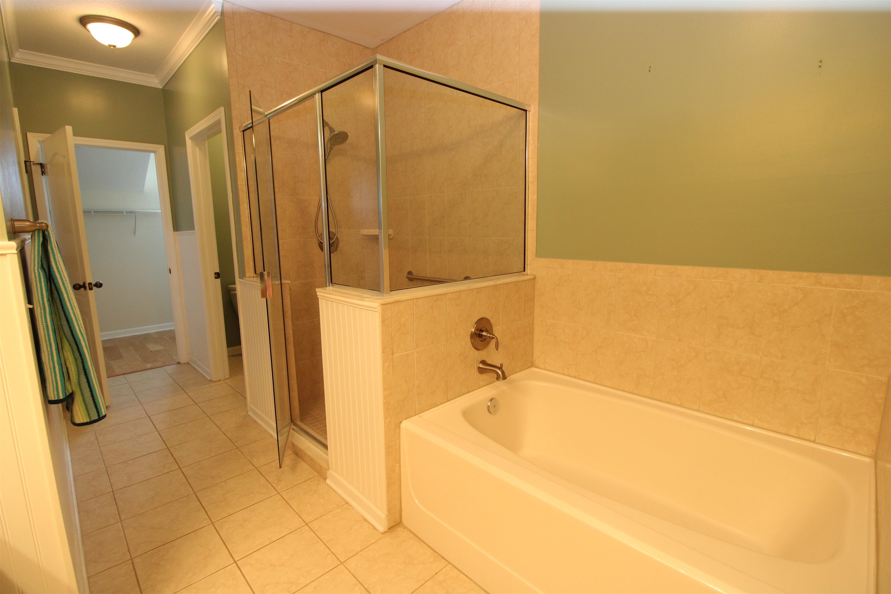 110 Magnolia Crossing Point, Unit 1905 St. Augustine, FL 32086 - Photo 21 of 42 a bathroom with a bathtub and a shower