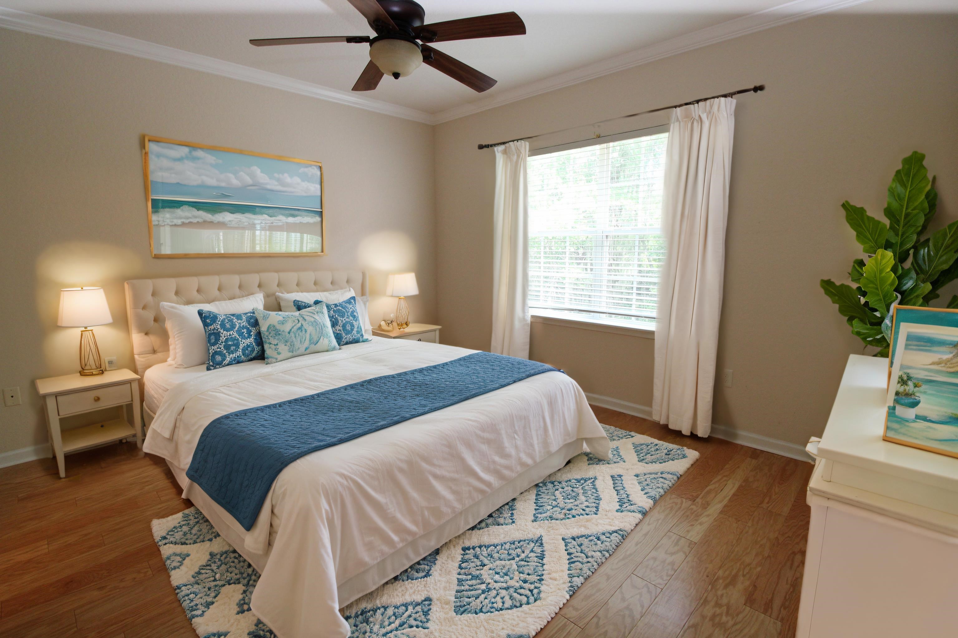 110 Magnolia Crossing Point, Unit 1905 St. Augustine, FL 32086 - Photo 23 of 42 a bedroom with a large bed chandelier and a window