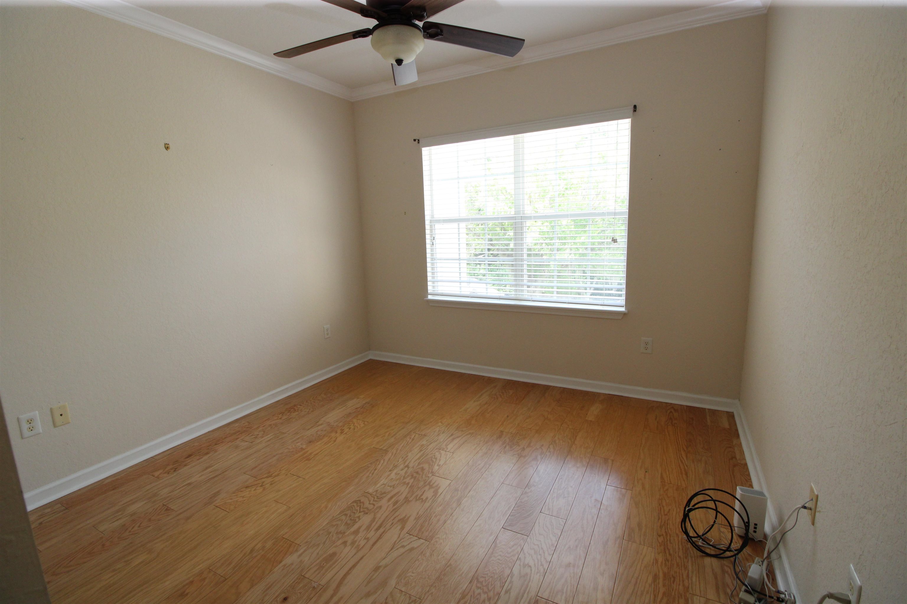 110 Magnolia Crossing Point, Unit 1905 St. Augustine, FL 32086 - Photo 24 of 42 an empty room with a window and a fan