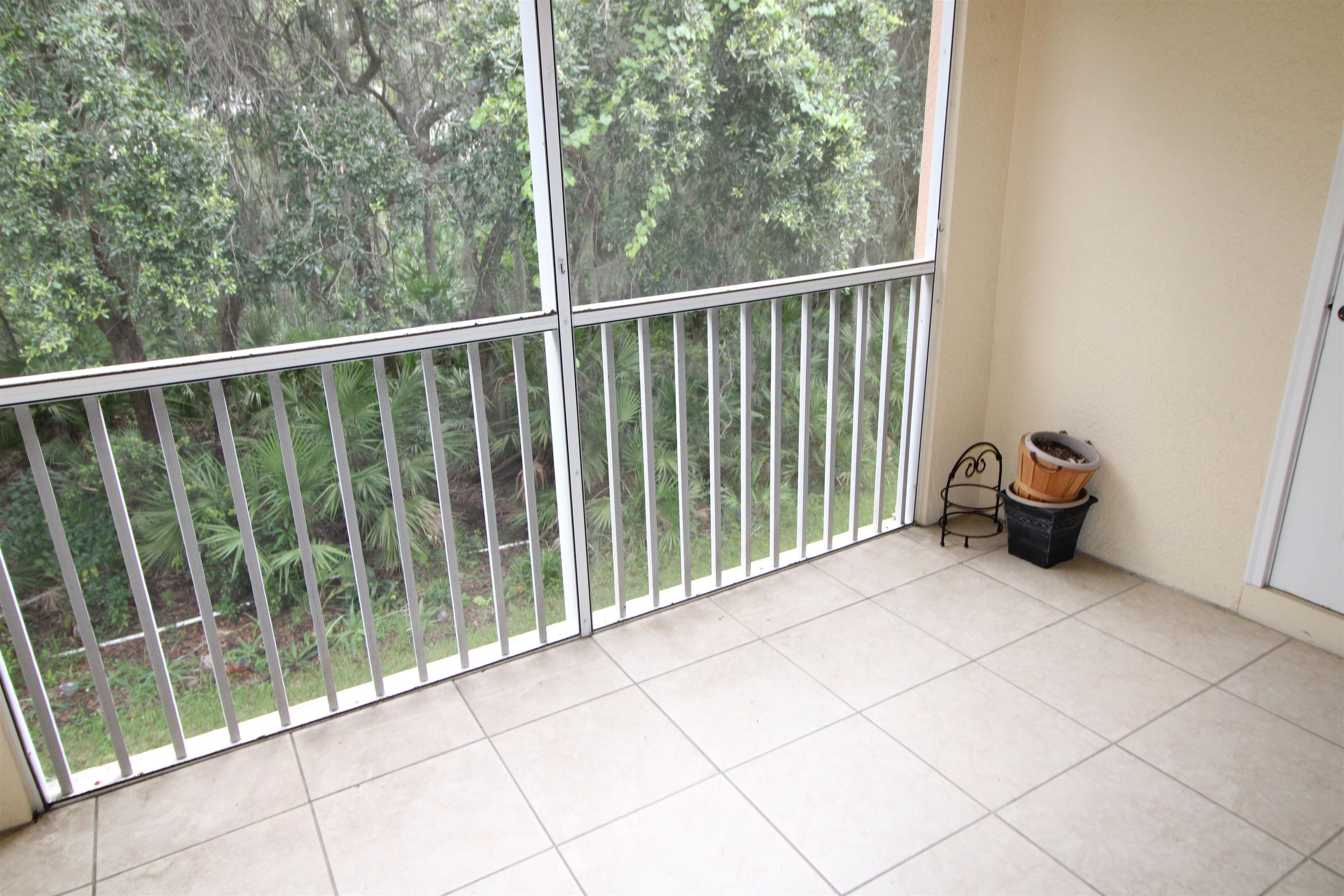 110 Magnolia Crossing Point, Unit 1905 St. Augustine, FL 32086 - Photo 34 of 42 a view of a two chairs and table in a balcony