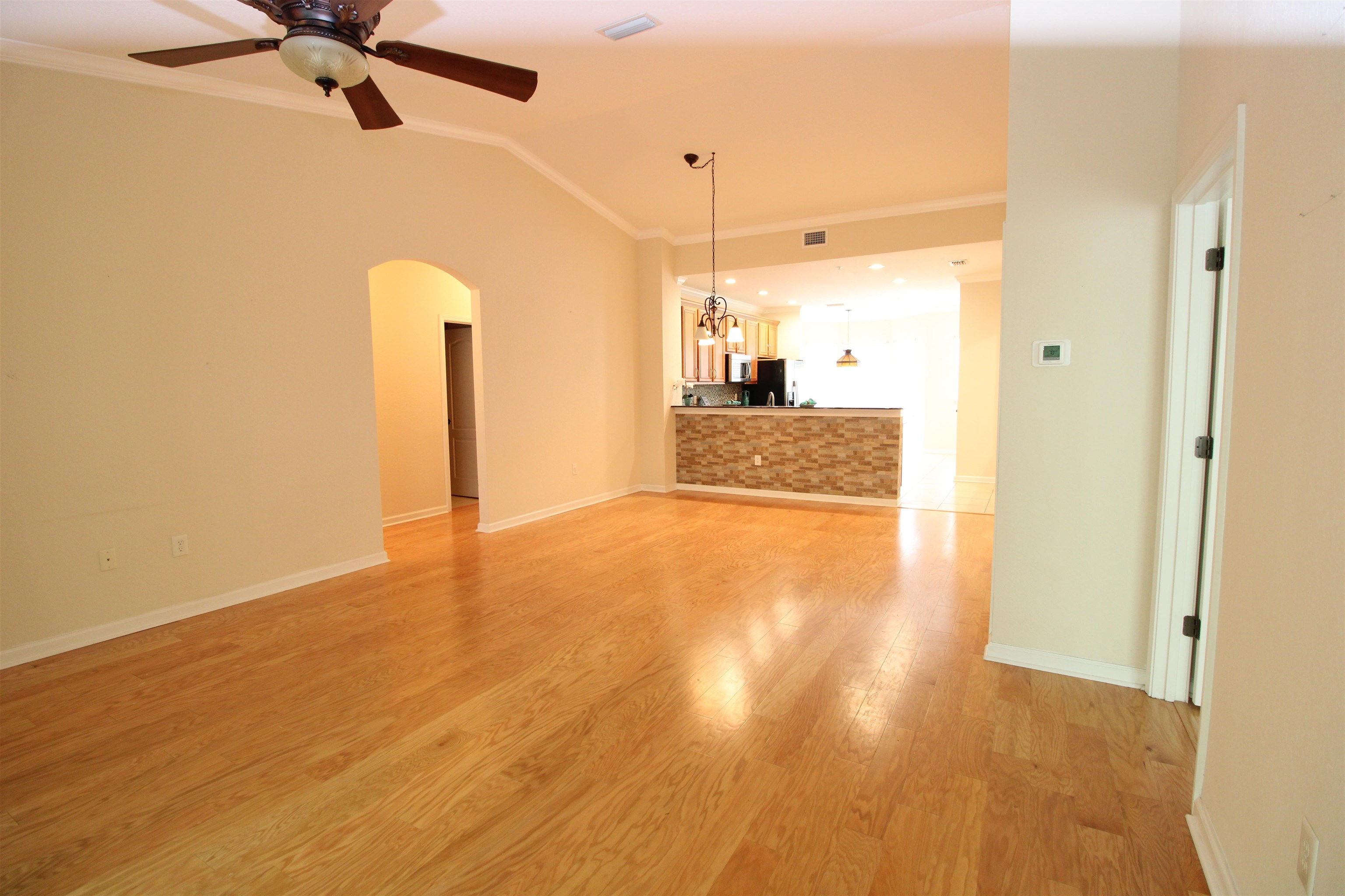 110 Magnolia Crossing Point, Unit 1905 St. Augustine, FL 32086 - Photo 7 of 42 a view of a kitchen with a sink and a refrigerator