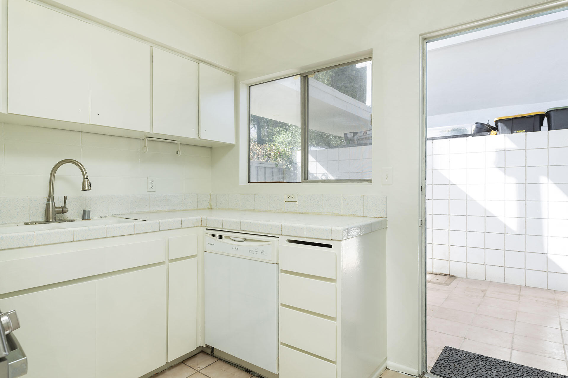 42336 Dunes View Road, Unit 12 Rancho Mirage, CA 92270 - Photo 16 of 29 a kitchen with a sink cabinets and window
