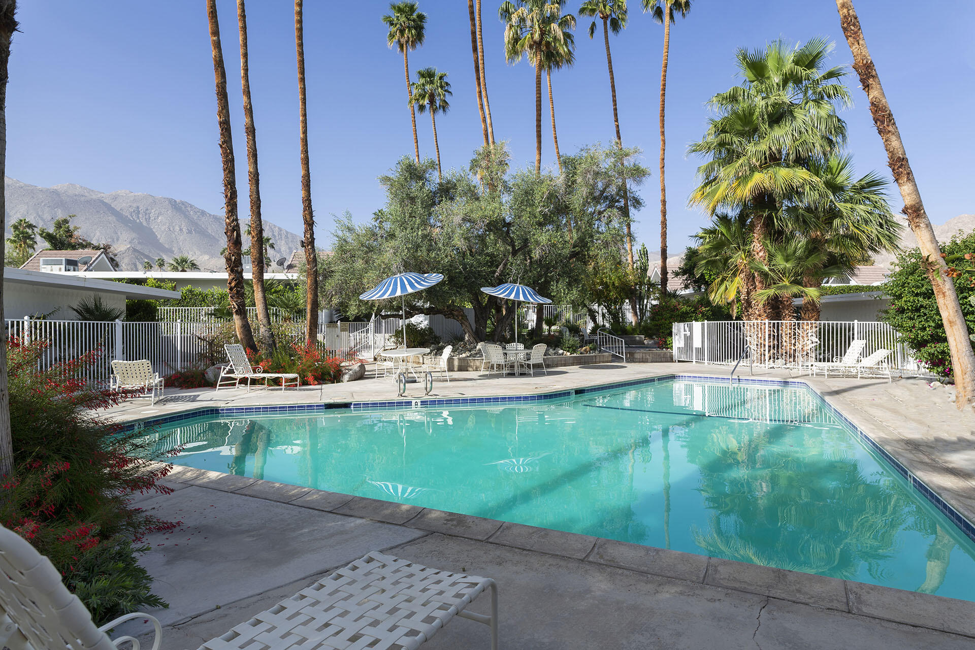 42336 Dunes View Road, Unit 12 Rancho Mirage, CA 92270 - Photo 26 of 29 a view of a swimming pool with a patio