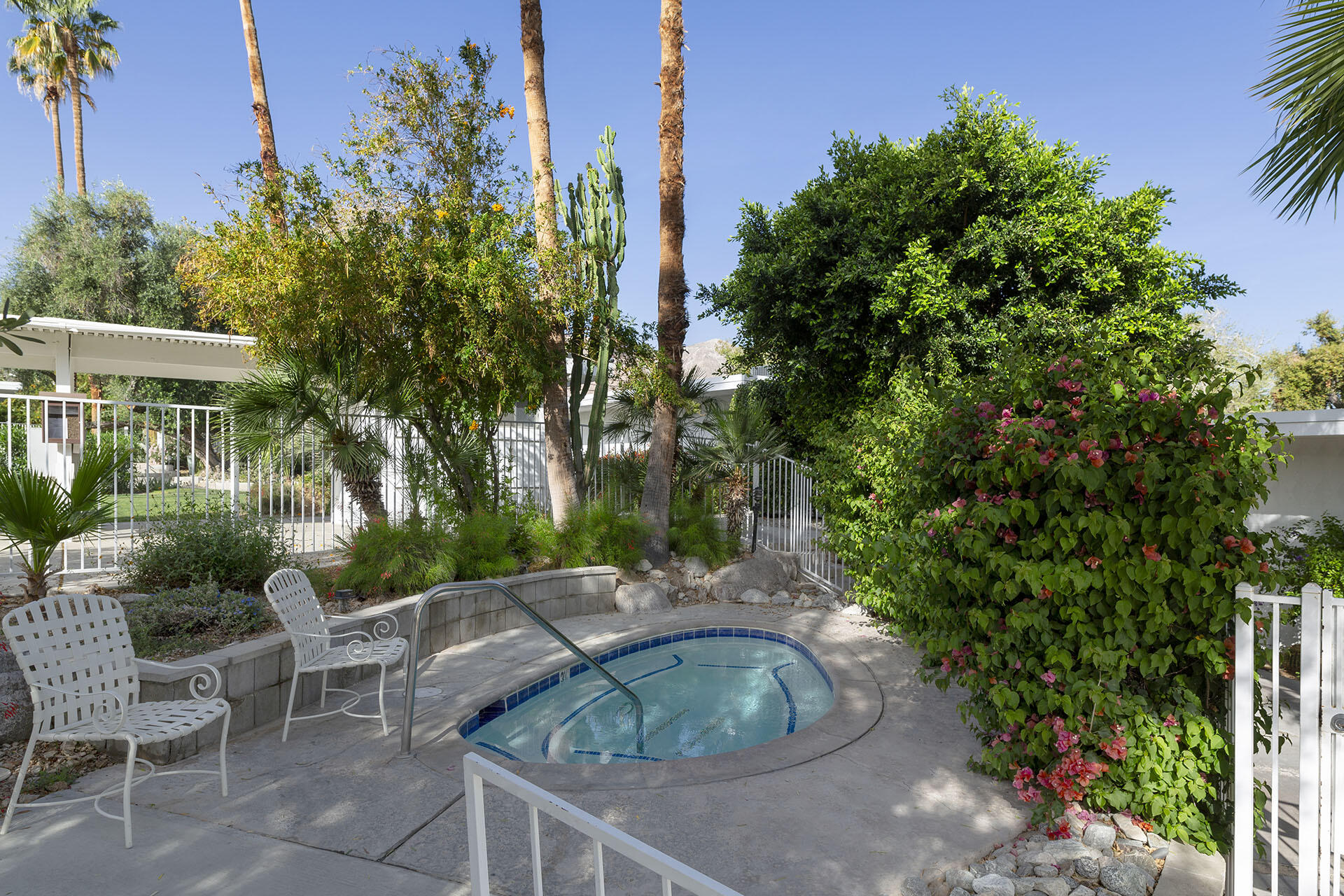 42336 Dunes View Road, Unit 12 Rancho Mirage, CA 92270 - Photo 28 of 29 a view of backyard with outdoor seating and green space