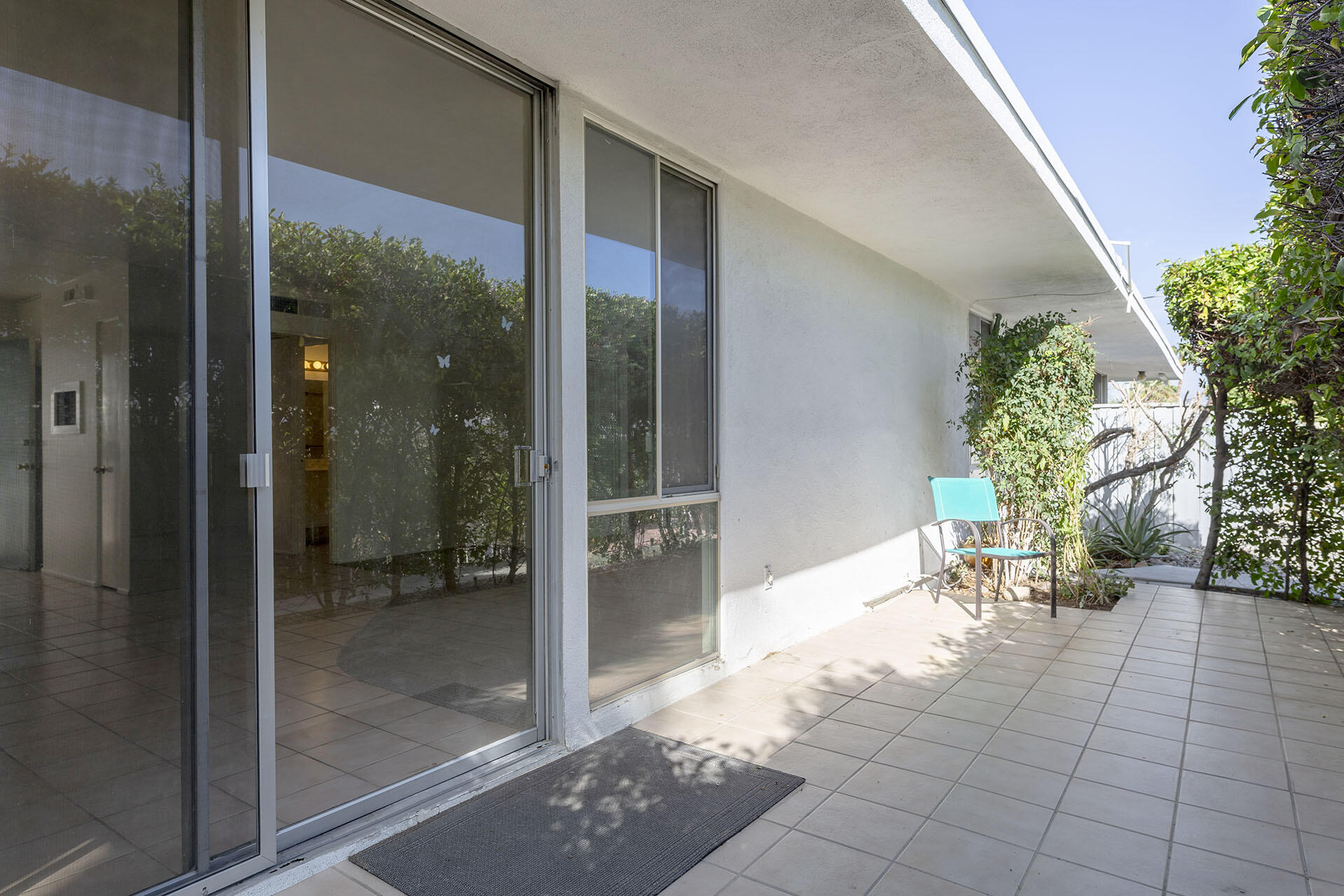 42336 Dunes View Road, Unit 12 Rancho Mirage, CA 92270 - Photo 7 of 29 a view of a porch with chairs and front door