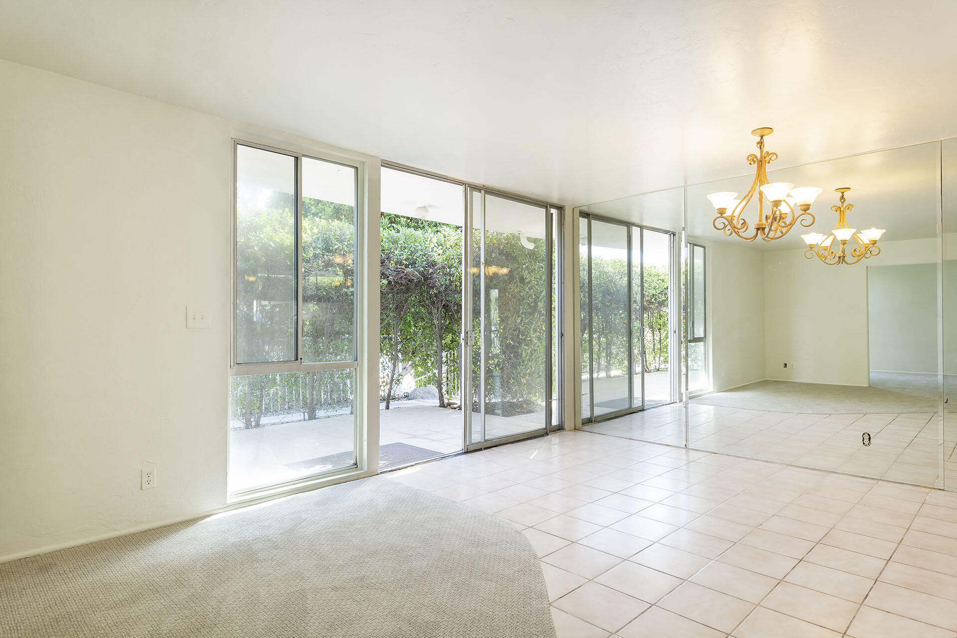 42336 Dunes View Road, Unit 12 Rancho Mirage, CA 92270 - Photo 9 of 29 a view of a room with sliding glass door and glass windows
