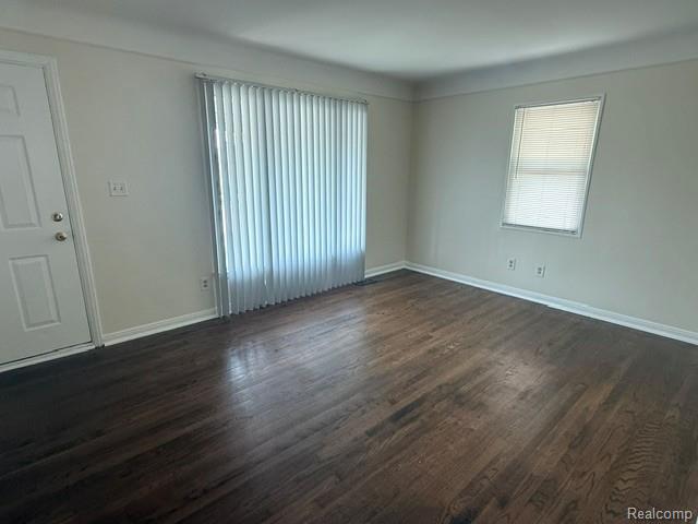 970 Champaign Road Lincoln Park, MI 48146 - Photo 3 of 28 Living Room featuring dark wood-type flooring and baseboards