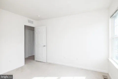 a bathroom with a sink toilet and a mirror