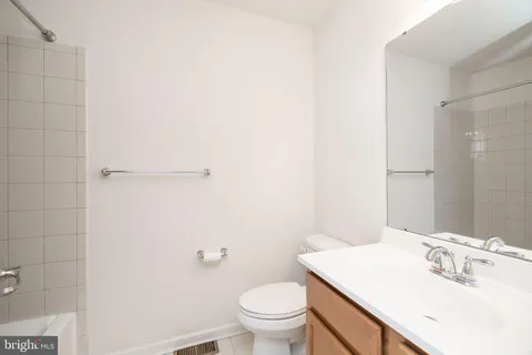 an empty room with a empty space and windows