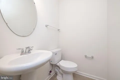 a view of a livingroom with a ceiling fan and window