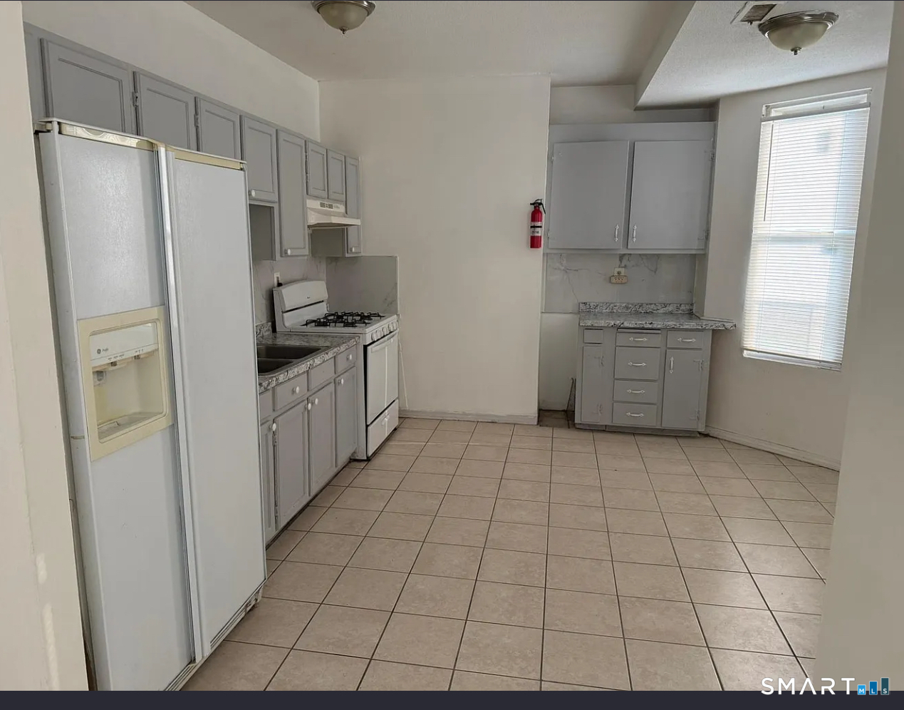46 Seyms Street Hartford, CT 06120 - Photo 2 of 8 a kitchen with stainless steel appliances a refrigerator sink and cabinets