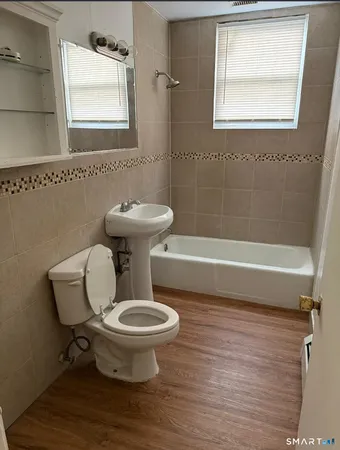 a bathroom with a toilet and a sink