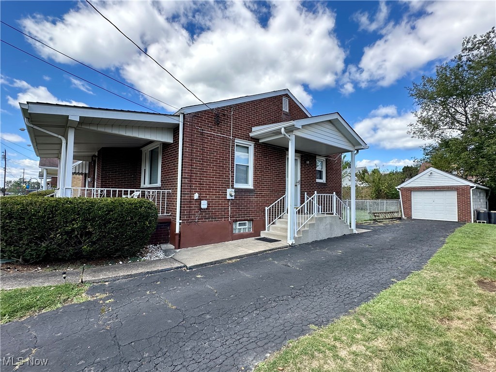 343 Raleigh Avenue Weirton, WV 26062 - Photo 45 of 46 Bungalow featuring an outdoor structure, a garage, and covered porch