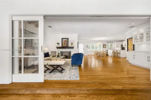 a living room with fireplace furniture and a flat screen tv