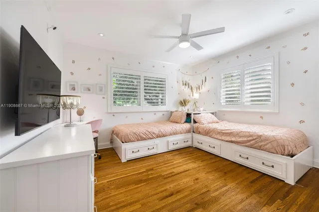 a spacious bedroom with a bed and a window