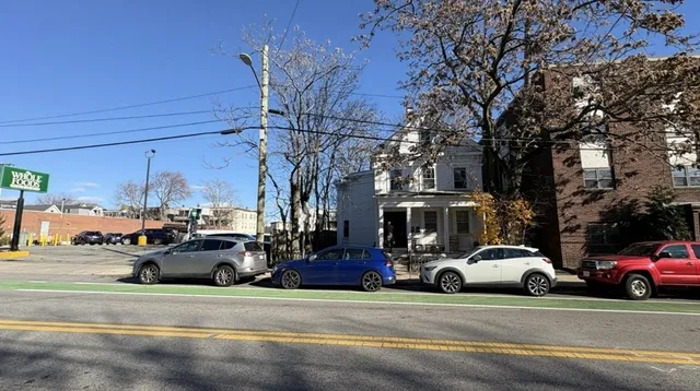 a view of a cars parked in front of a building