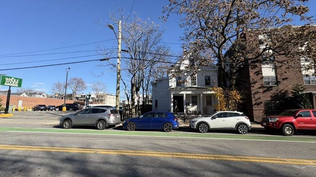 33 Beacon Street Somerville, MA 02143 - Photo 3 of 11 a view of a cars parked in front of a building