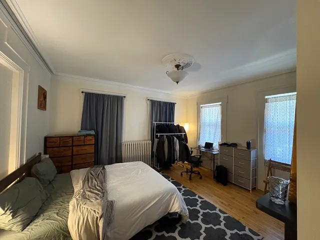 a bedroom with a bed and furniture