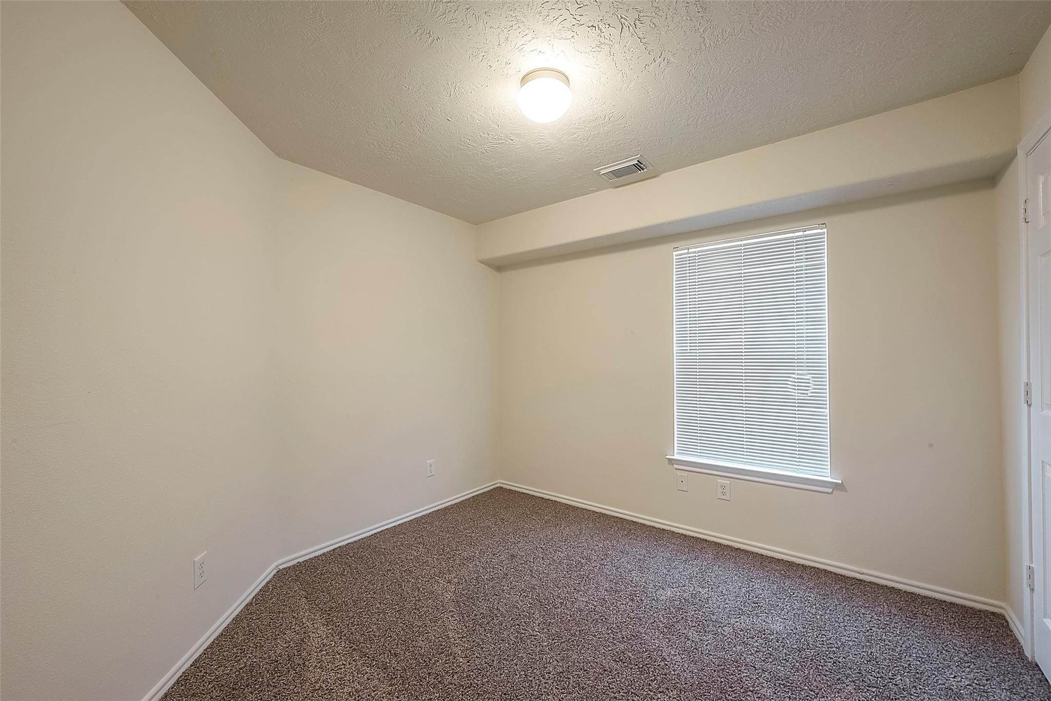 14330 Fairbuff Lane Houston, TX 77014 - Photo 12 of 35 an empty room with a window