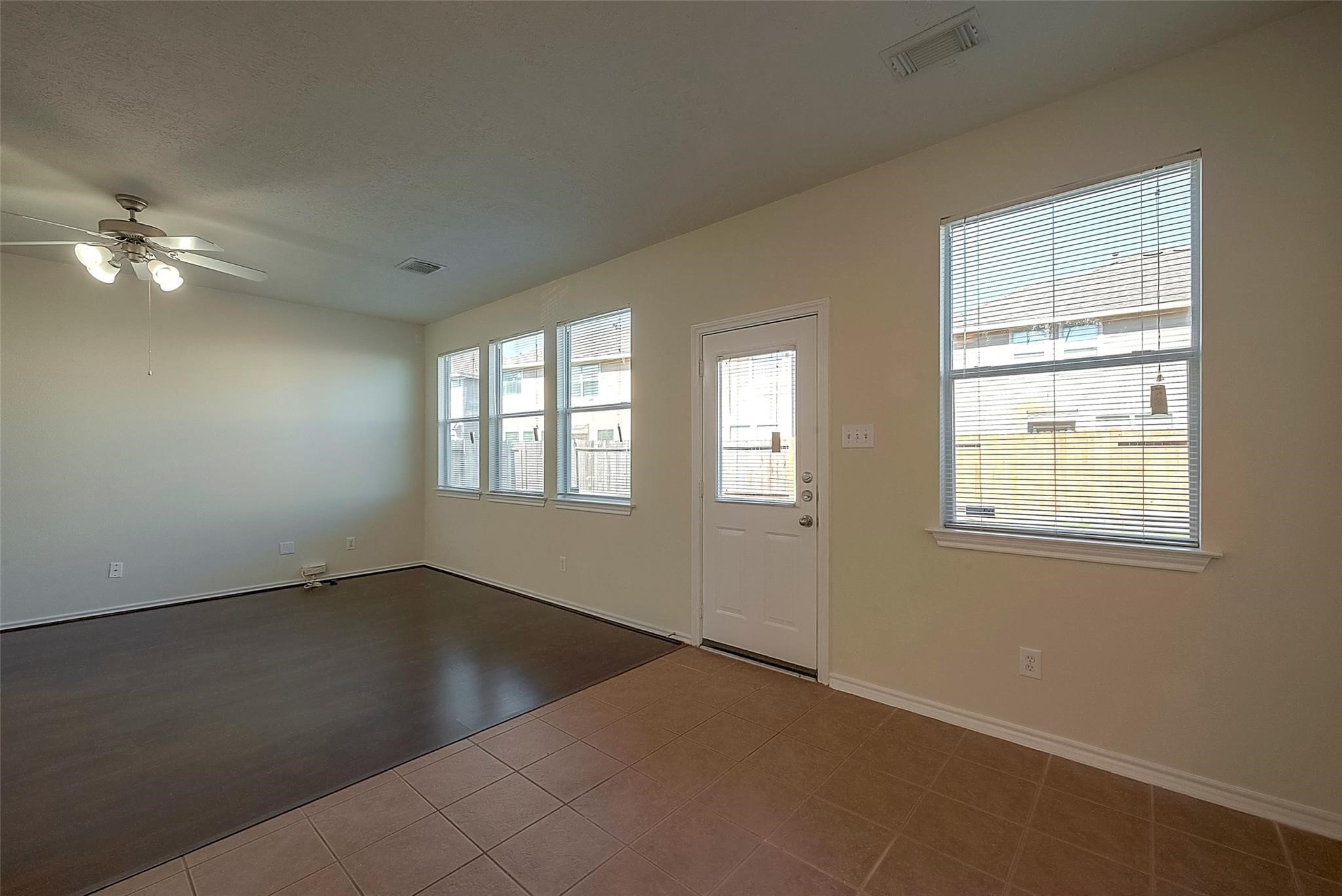 14330 Fairbuff Lane Houston, TX 77014 - Photo 15 of 35 an empty room with windows and fan