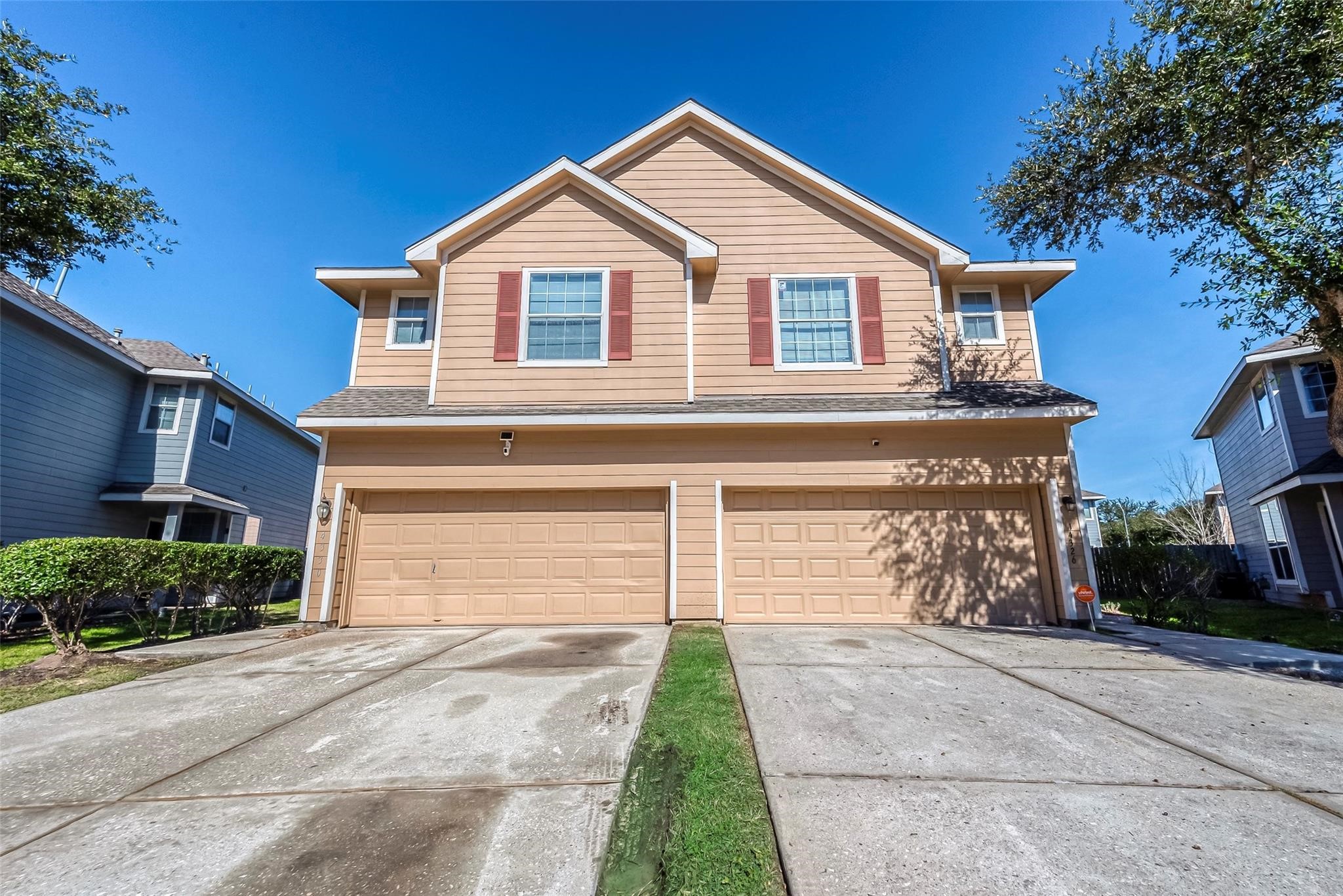 14330 Fairbuff Lane Houston, TX 77014 - Photo 2 of 35 a front view of a house with a yard and garage