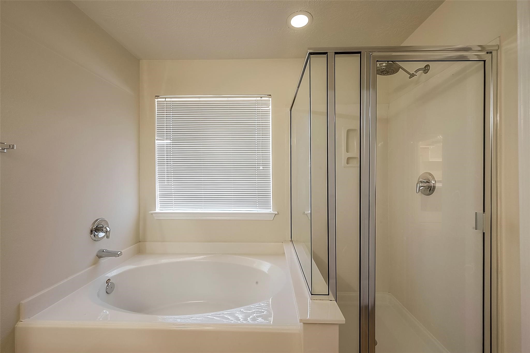 14330 Fairbuff Lane Houston, TX 77014 - Photo 24 of 35 a white bath tub sitting next to a shower