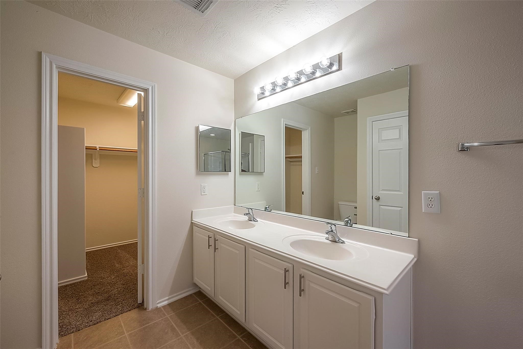 14330 Fairbuff Lane Houston, TX 77014 - Photo 25 of 35 a bathroom with a sink and a mirror