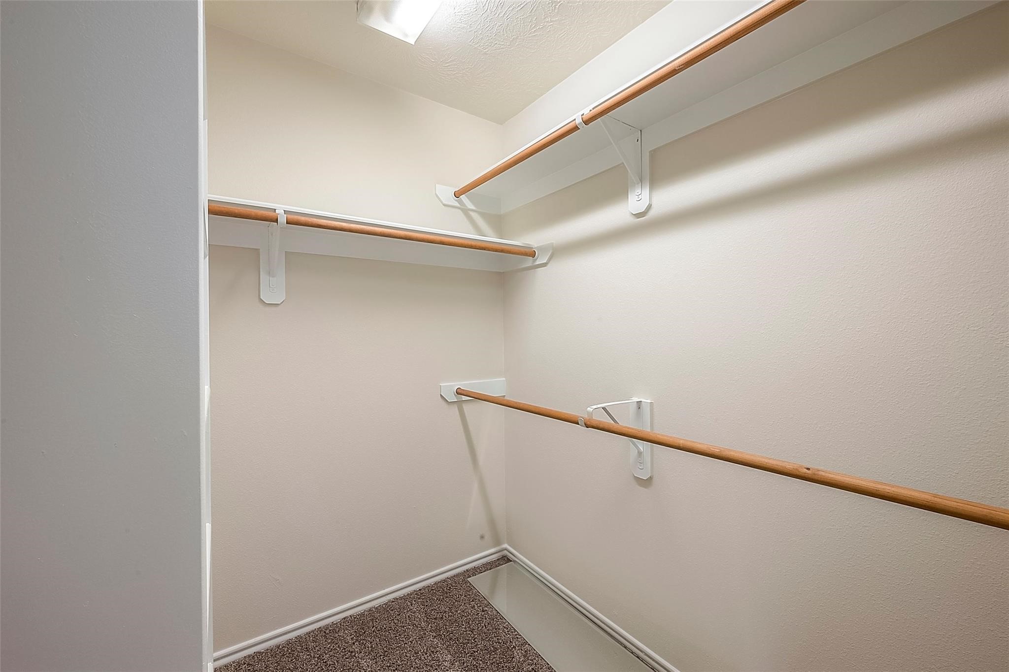 14330 Fairbuff Lane Houston, TX 77014 - Photo 26 of 35 a view of an empty walk in closet