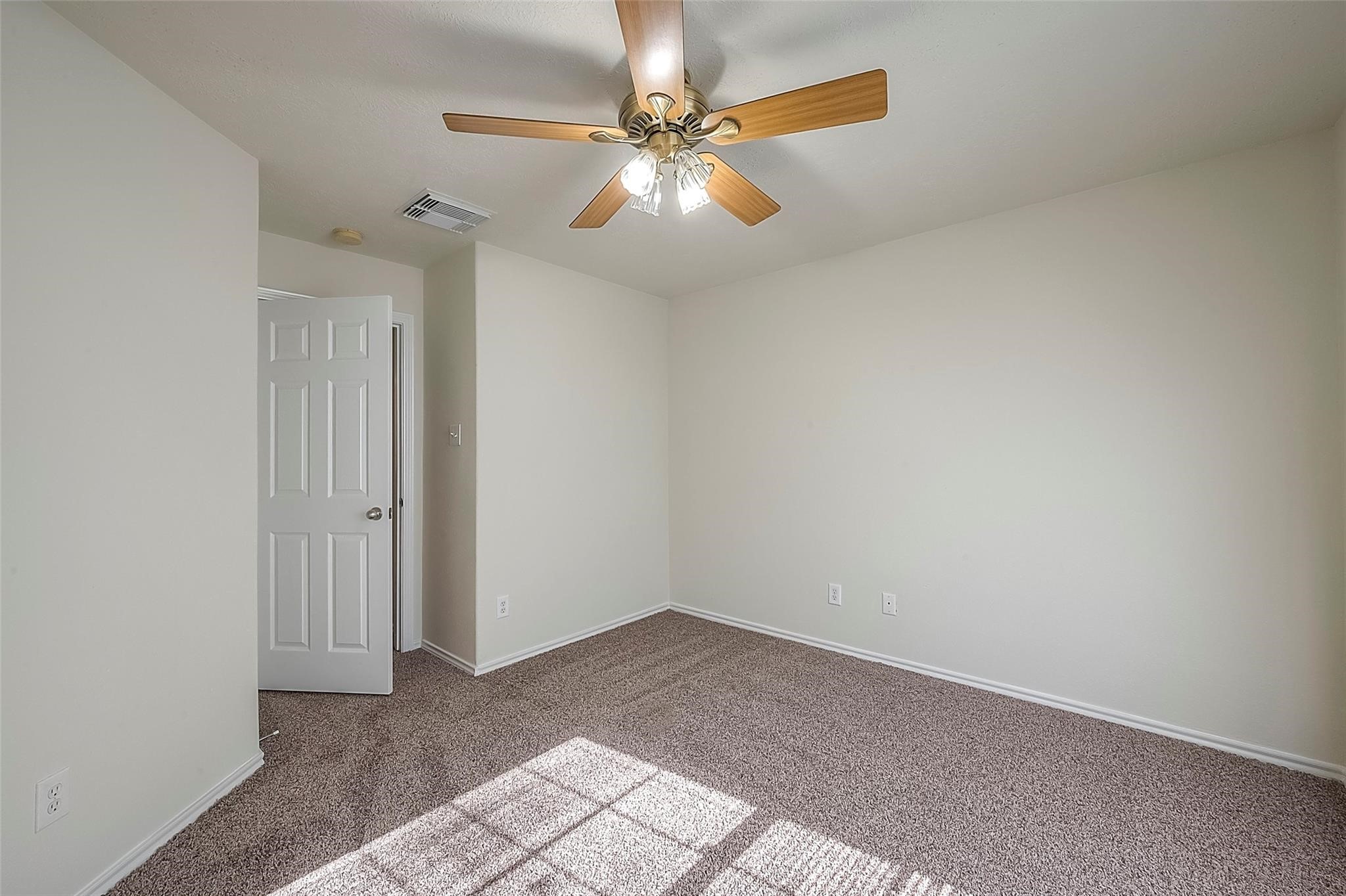 14330 Fairbuff Lane Houston, TX 77014 - Photo 28 of 35 an empty room with windows and fan