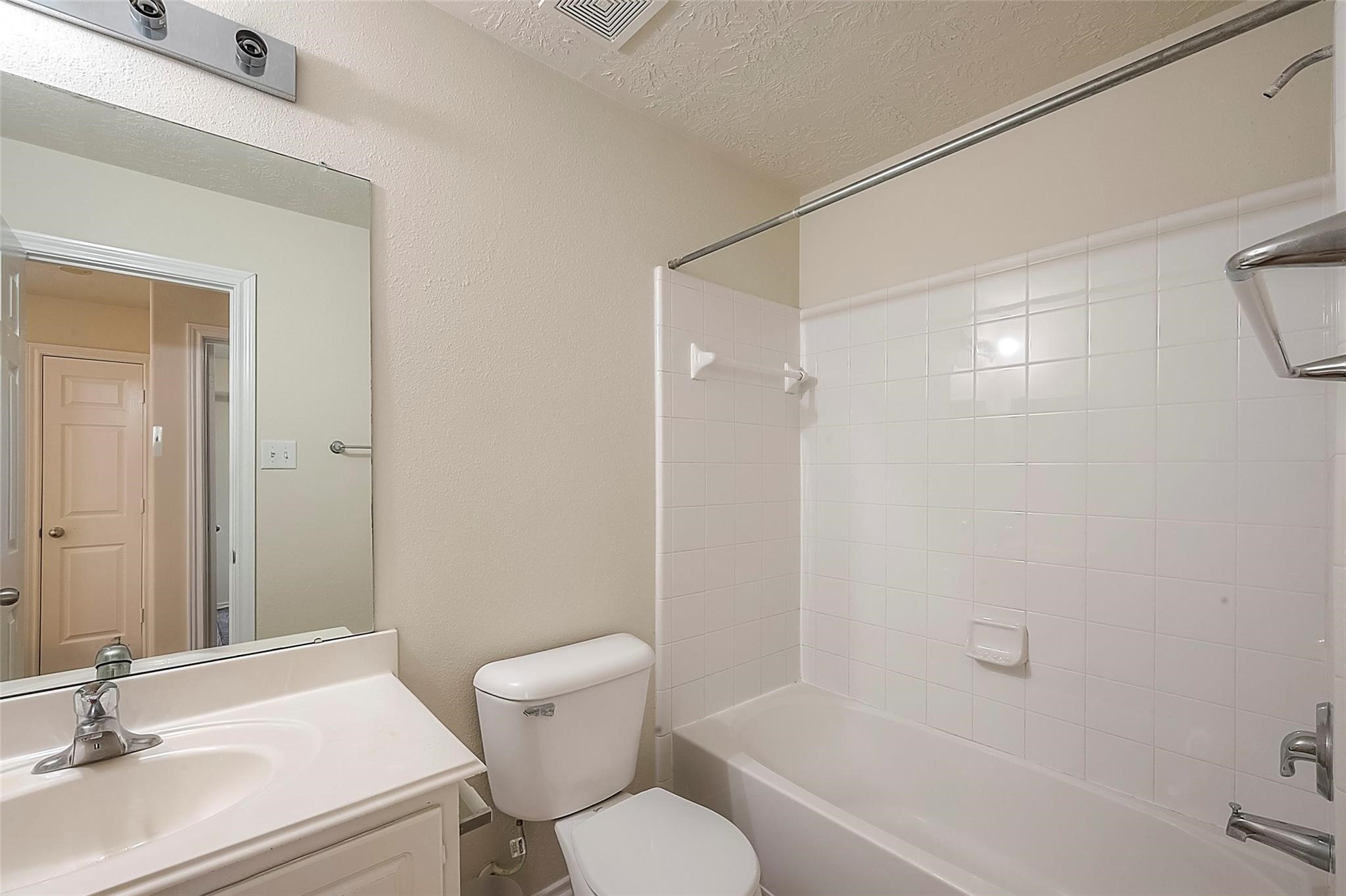 14330 Fairbuff Lane Houston, TX 77014 - Photo 30 of 35 a bathroom with a sink toilet and shower