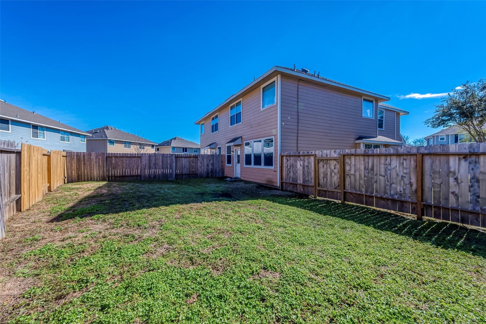 14330 Fairbuff Lane Houston, TX 77014 - Photo 32 of 35 a view of a backyard with wooden fence
