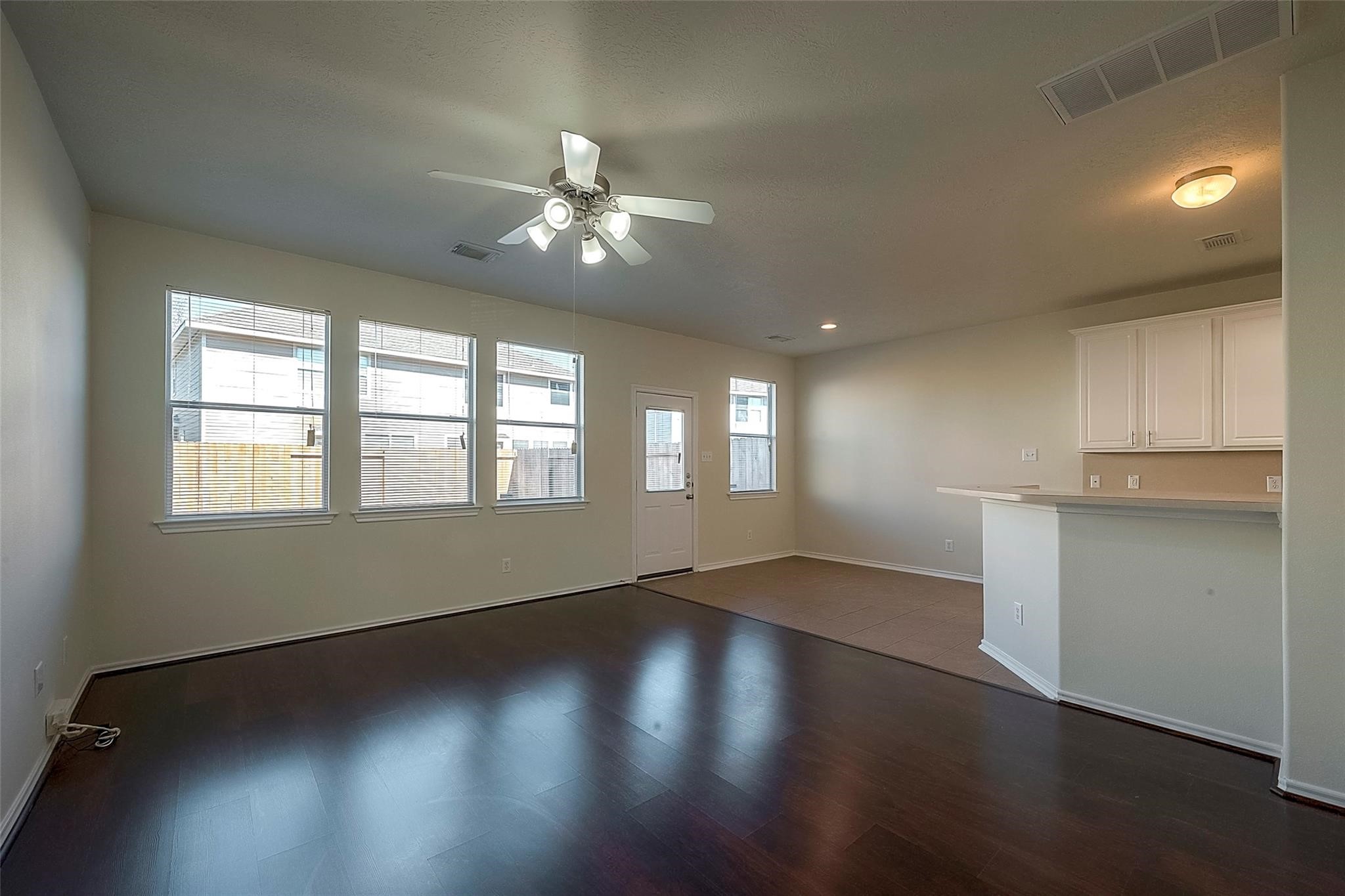 14330 Fairbuff Lane Houston, TX 77014 - Photo 6 of 35 a view of empty room with wooden floor and fan