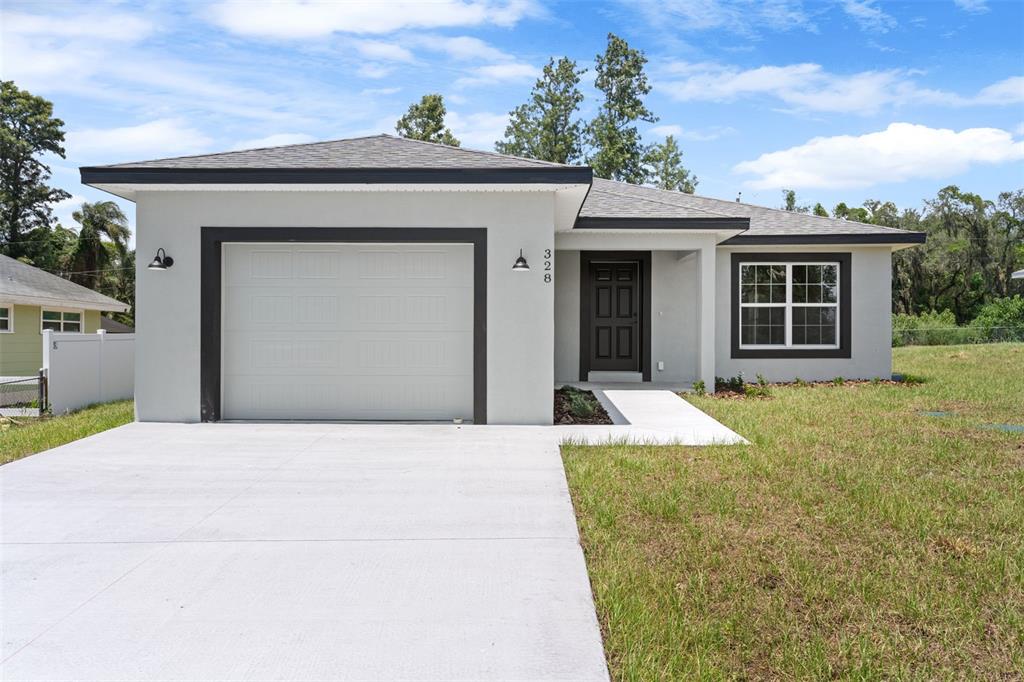 328 Eucalyptus Road Lake Wales, FL 33898 - Photo 1 of 1 a house view with a garden space