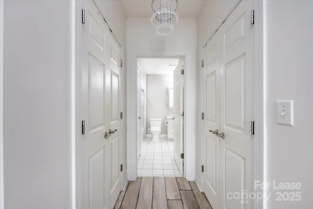 a view of a bathroom from a hallway