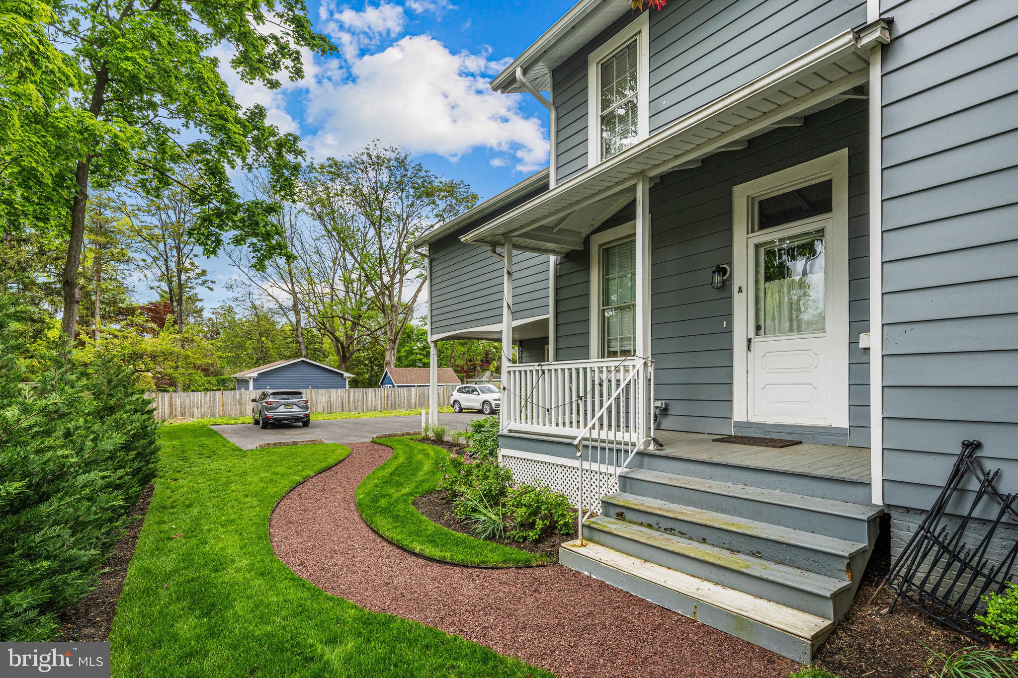 15 A Potter Street Haddonfield, NJ 08033 - Photo 10 of 11 a front view of a house with a garden and patio