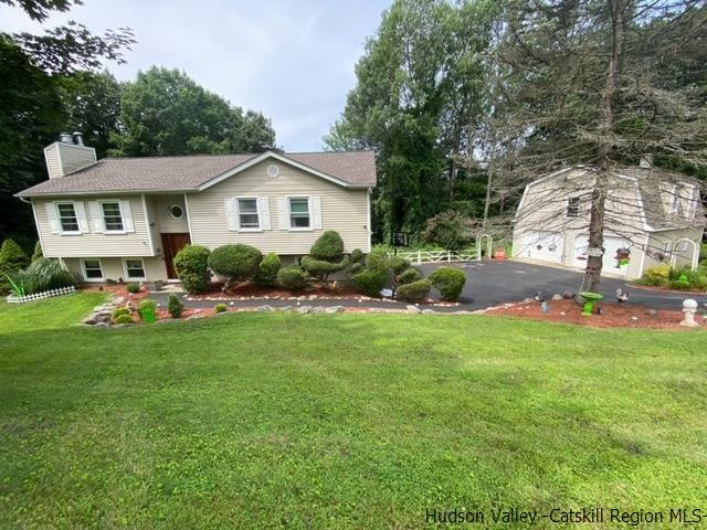 18 Maria Drive Holmes, NY 12531 - Photo 1 of 35 a front view of a house with a yard and trees