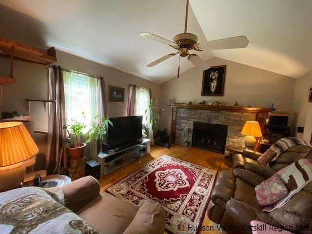 18 Maria Drive Holmes, NY 12531 - Photo 3 of 35 a living room with furniture a fireplace and a flat screen tv