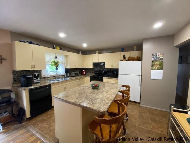 18 Maria Drive Holmes, NY 12531 - Photo 5 of 35 a kitchen with refrigerator and stove top oven