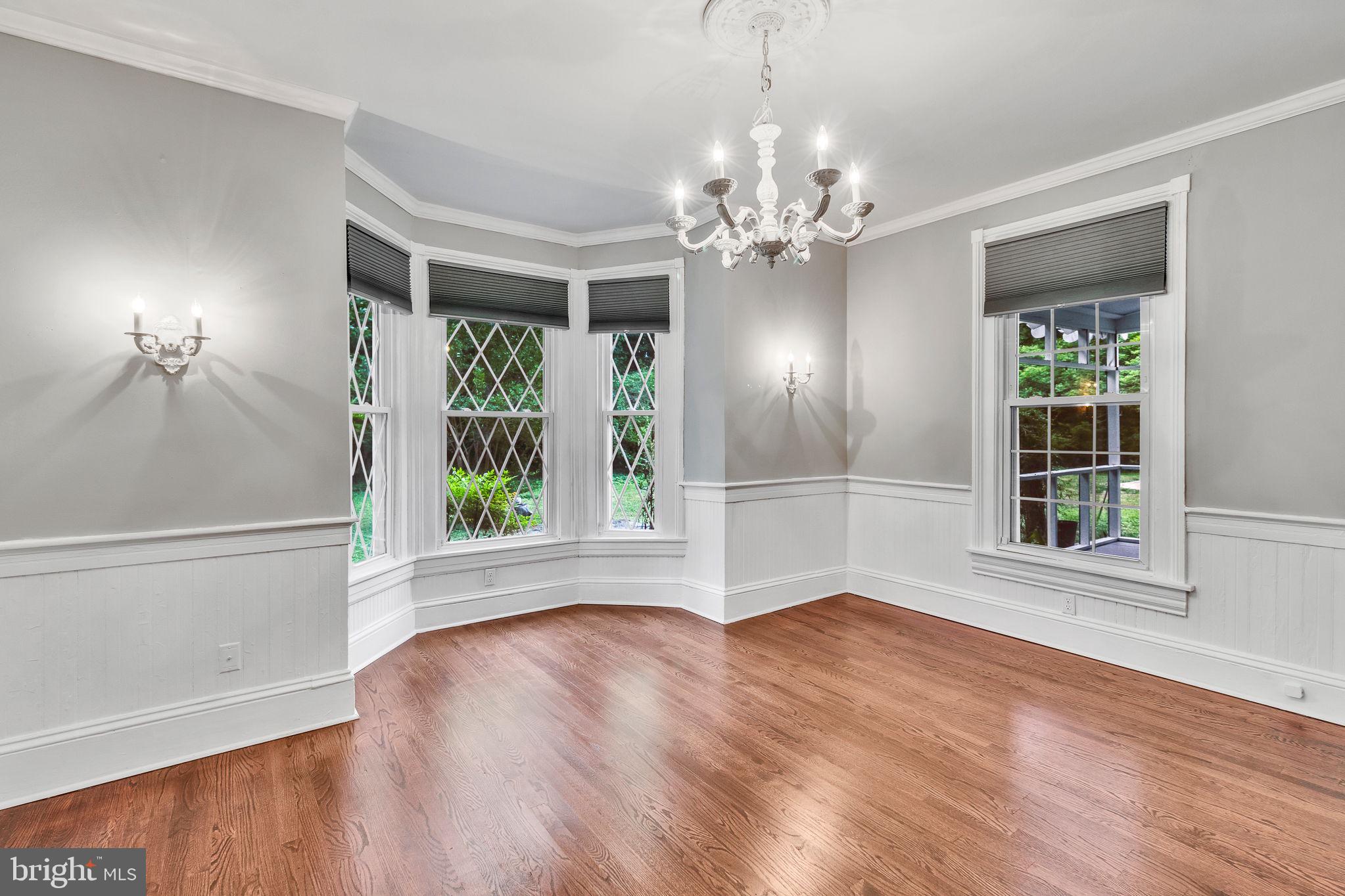 3952 Irvington Road Irvington, VA 22480 - Photo 6 of 77 a view of an empty room with wooden floor and a window