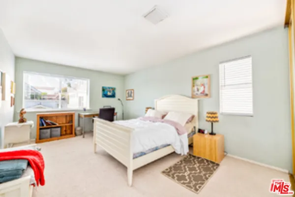 a room with a bed and a chair