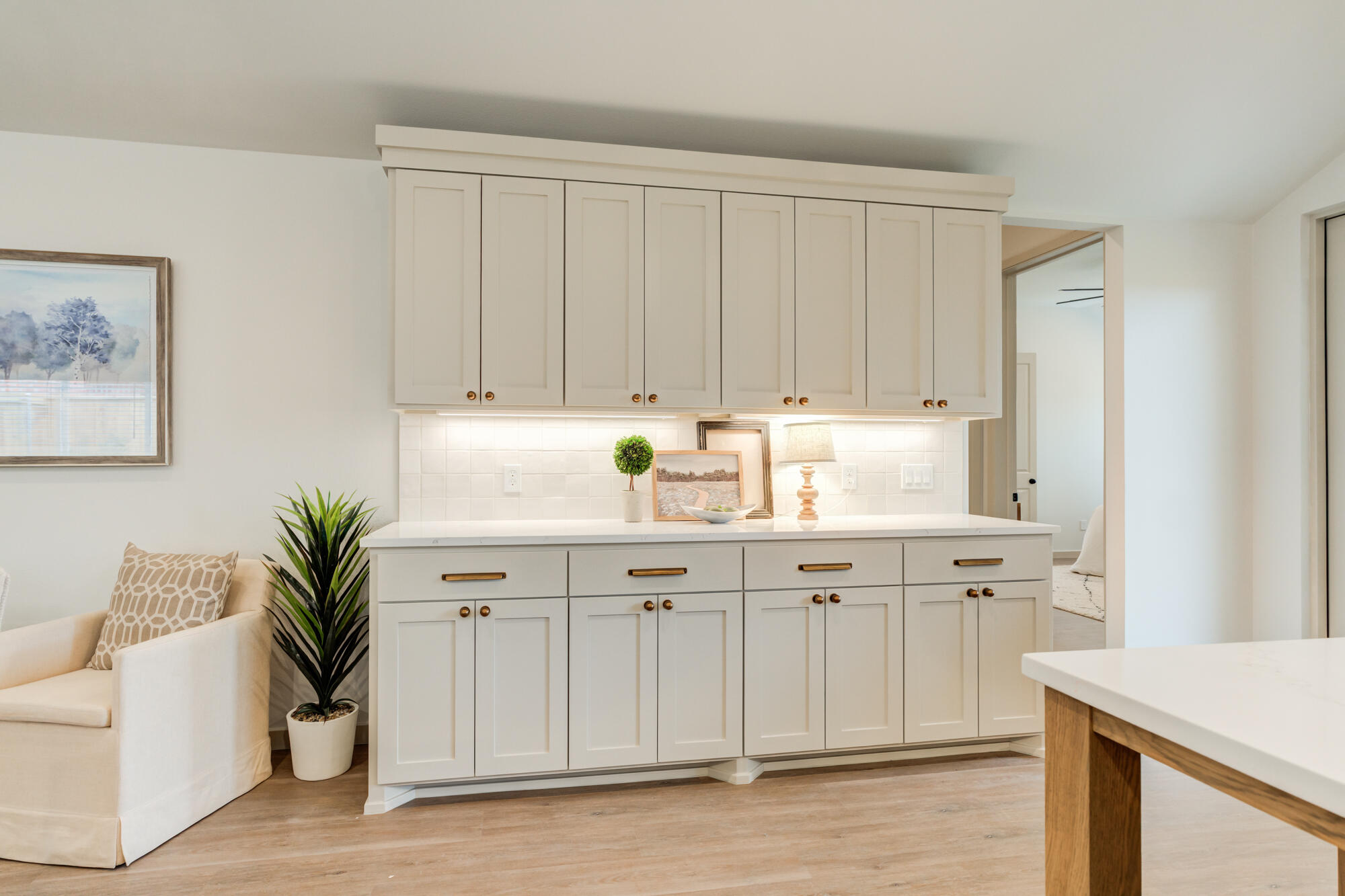 3627 122nd Street Lubbock, TX 79423 - Photo 18 of 49 a sink with white cabinets and wooden floor