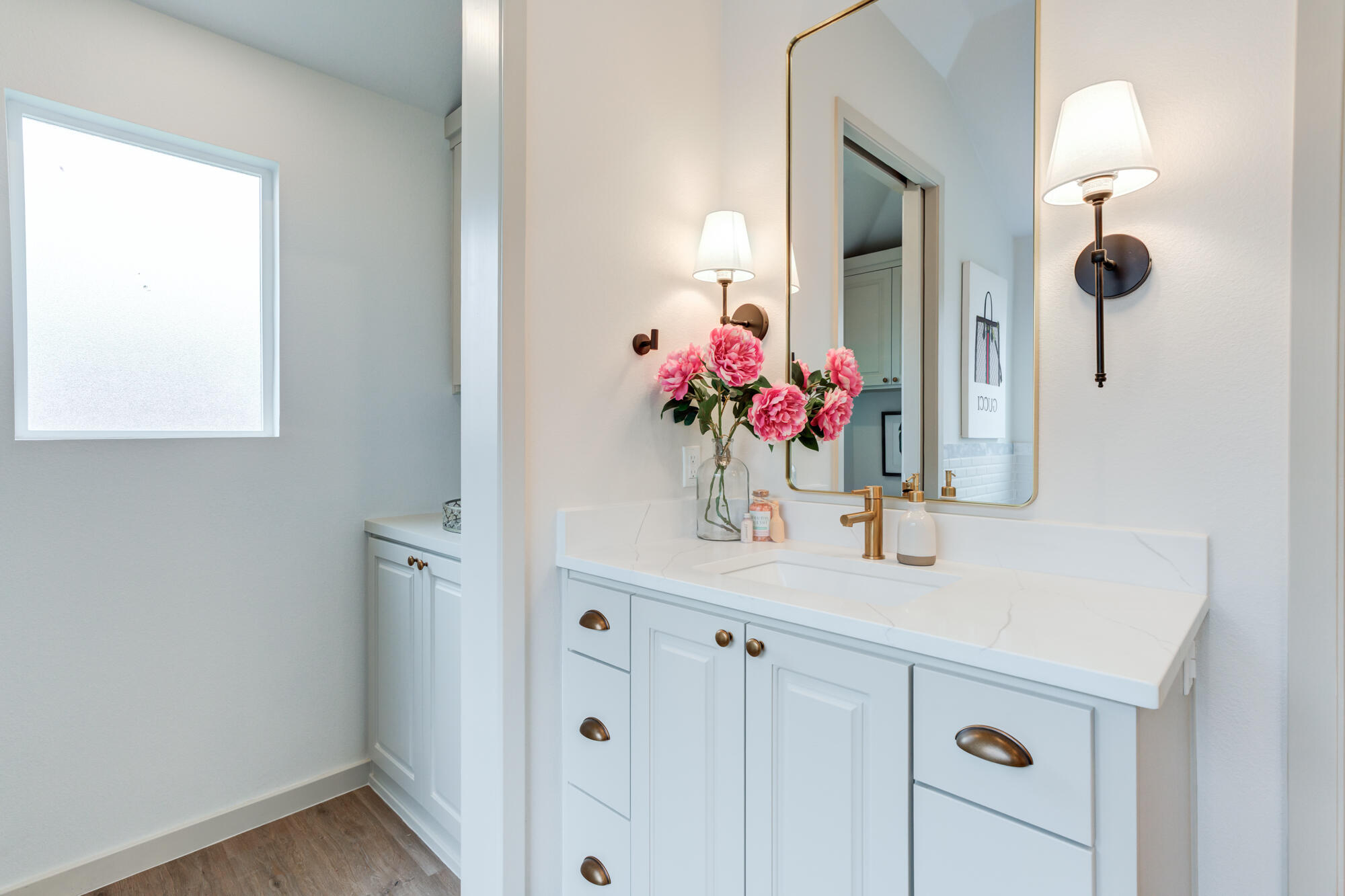 3627 122nd Street Lubbock, TX 79423 - Photo 28 of 49 a bathroom with a sink vanity and mirror
