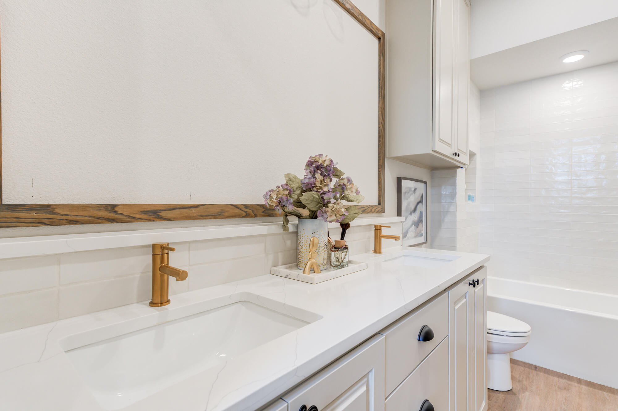 3627 122nd Street Lubbock, TX 79423 - Photo 36 of 49 a bathroom with a sink a toilet and mirror