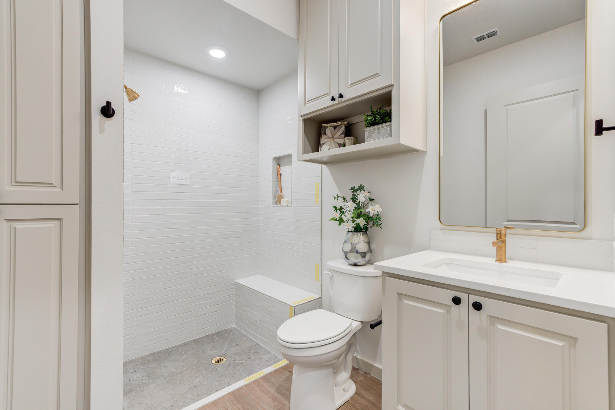 3627 122nd Street Lubbock, TX 79423 - Photo 42 of 49 a bathroom with a sink a toilet and shower