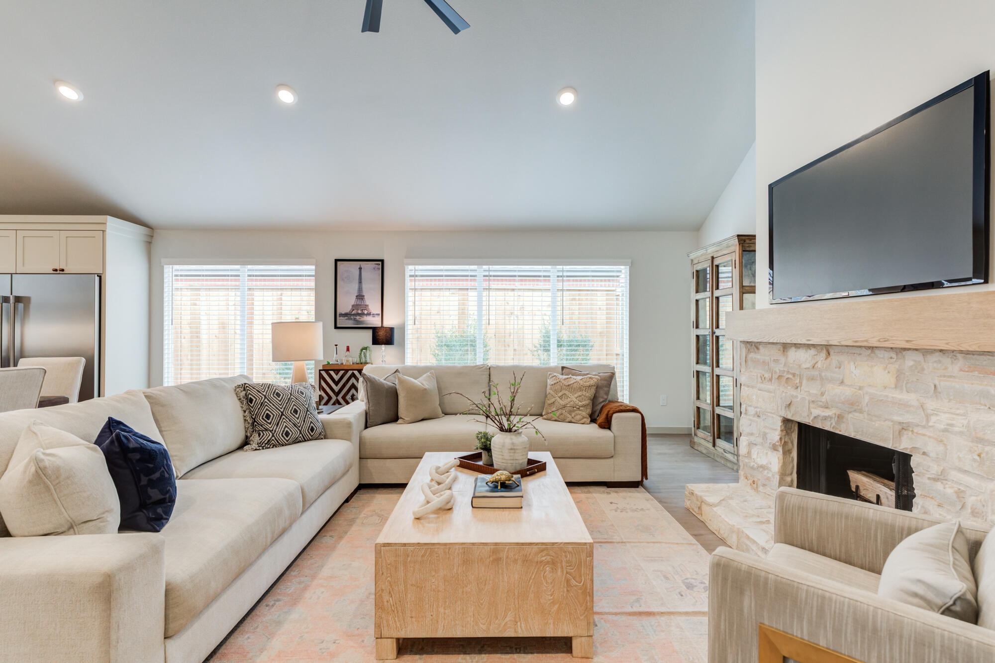3627 122nd Street Lubbock, TX 79423 - Photo 6 of 49 a living room with furniture a flat screen tv and a fireplace