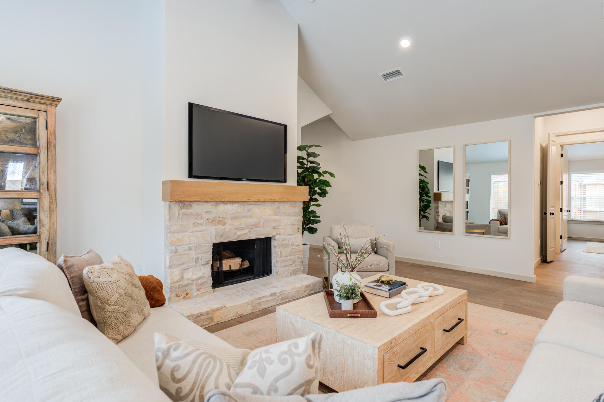 3627 122nd Street Lubbock, TX 79423 - Photo 10 of 49 a living room with furniture a fireplace and a flat screen tv