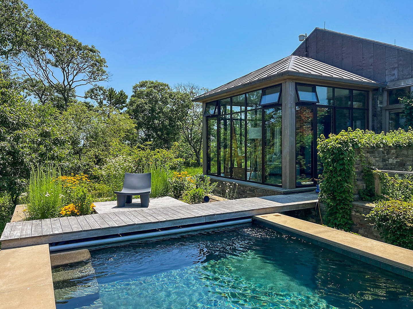 33 Boldwater Road Edgartown, MA 02539 - Photo 13 of 20 a view of a house with backyard sitting area and garden