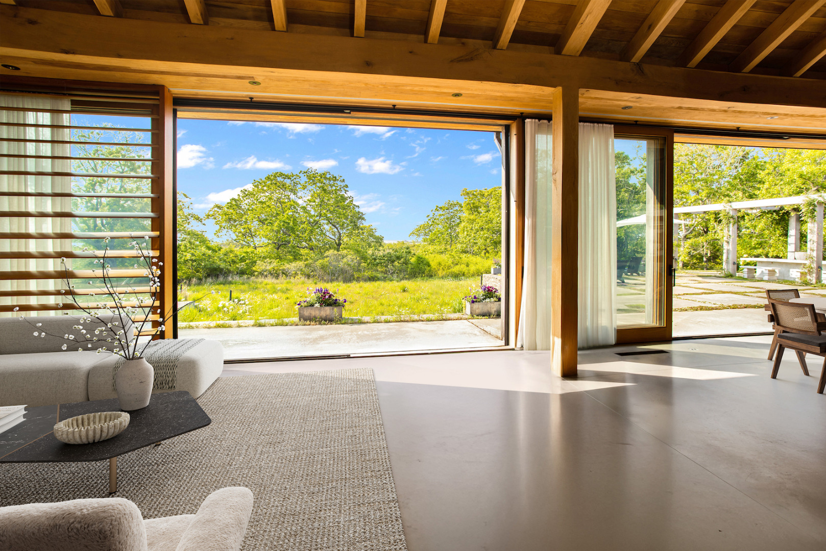 33 Boldwater Road Edgartown, MA 02539 - Photo 3 of 20 a view of a floor to ceiling window with wooden floor